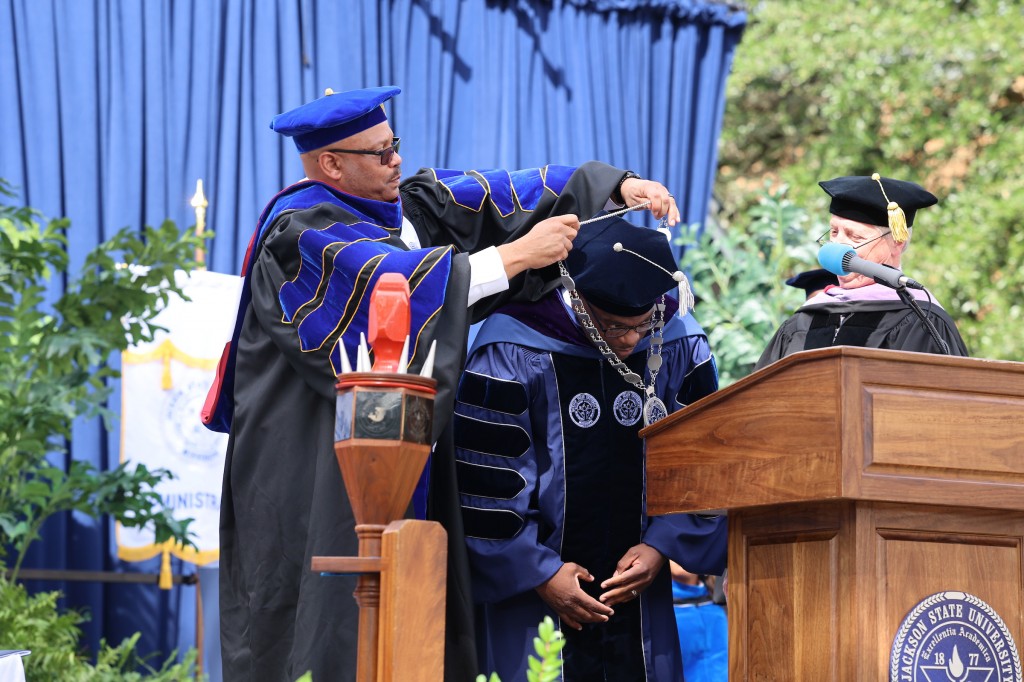 President Thomas K. Hudson receives the medallion of office from Trustee Steven Cunningham, M.D., and Trustee Walt Starr, DDs, during the Jackson State University investiture ceremony on October 14, 2021.