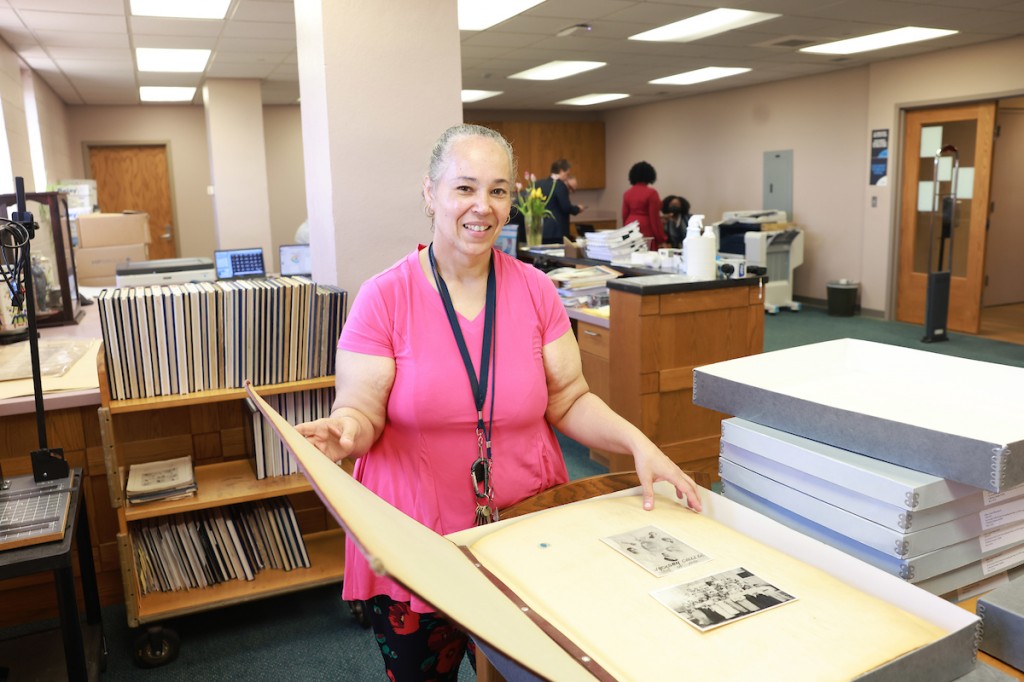 JSU Archivist Darlita Ballard looks through a stack of photos to digitize. (University Communications / William Kelly)