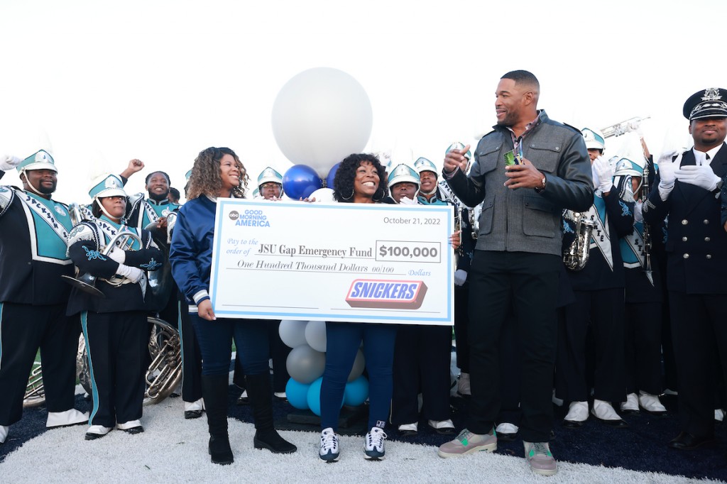 Jackson State University Chief Communications Officer Alonda Thomas and Director of Public Relations Rachel James-Terry accept a $100,000 check from Mars in support of the JSU Gap Emergency Fund. (JSU Communications / William H. Kelly)