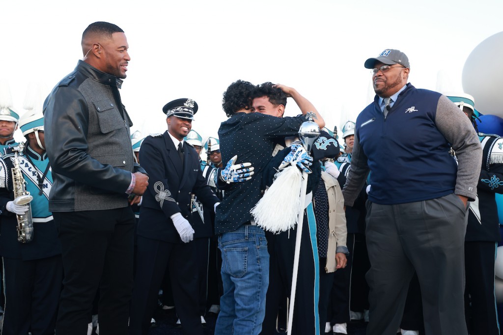 JSU Head Drum Major Marvin Meda is surprised by his mother, brother and former high school band director. (JSU Communications / William H. Kelly)