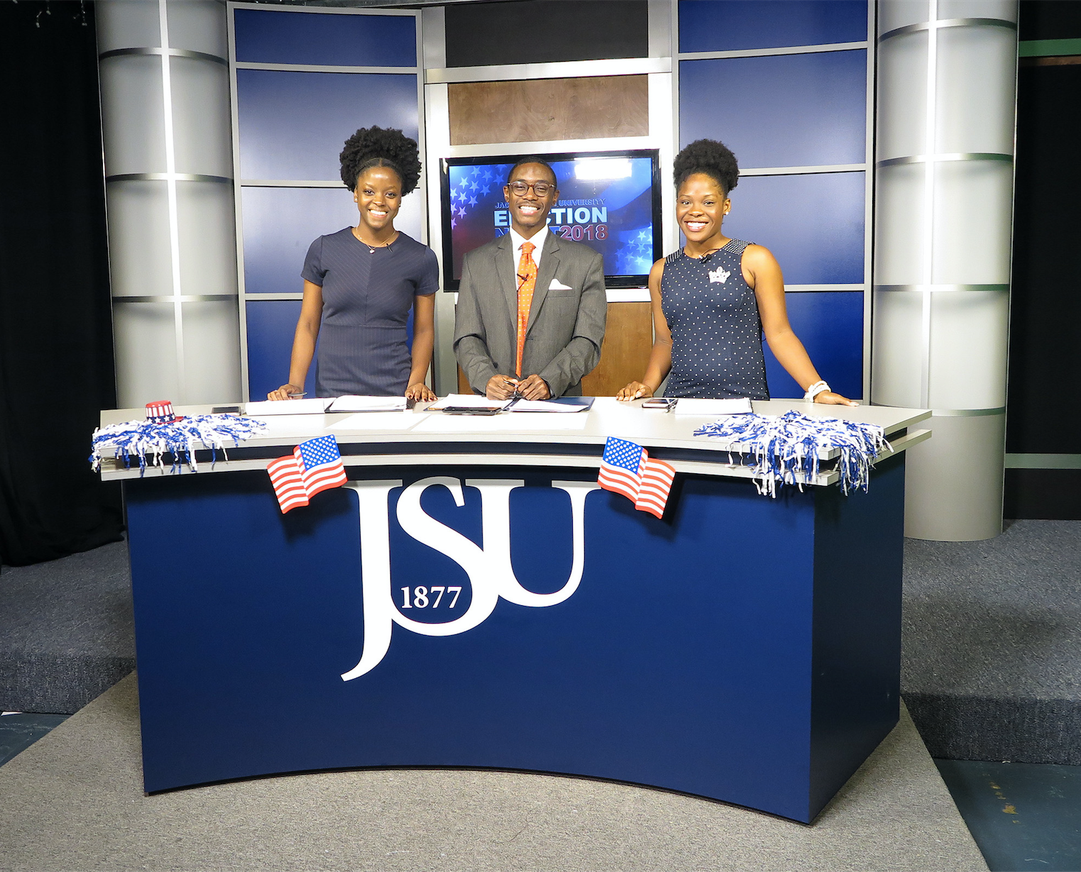 Media studies students, who have since graduated, Cianna Reeves (left), Clement Gibson and Gabrielle Baker (right) put their interview skills to the test during 2018 election night coverage at the Mississippi e-Center at JSU. (Photo by Rachel James-Terry/JSU)