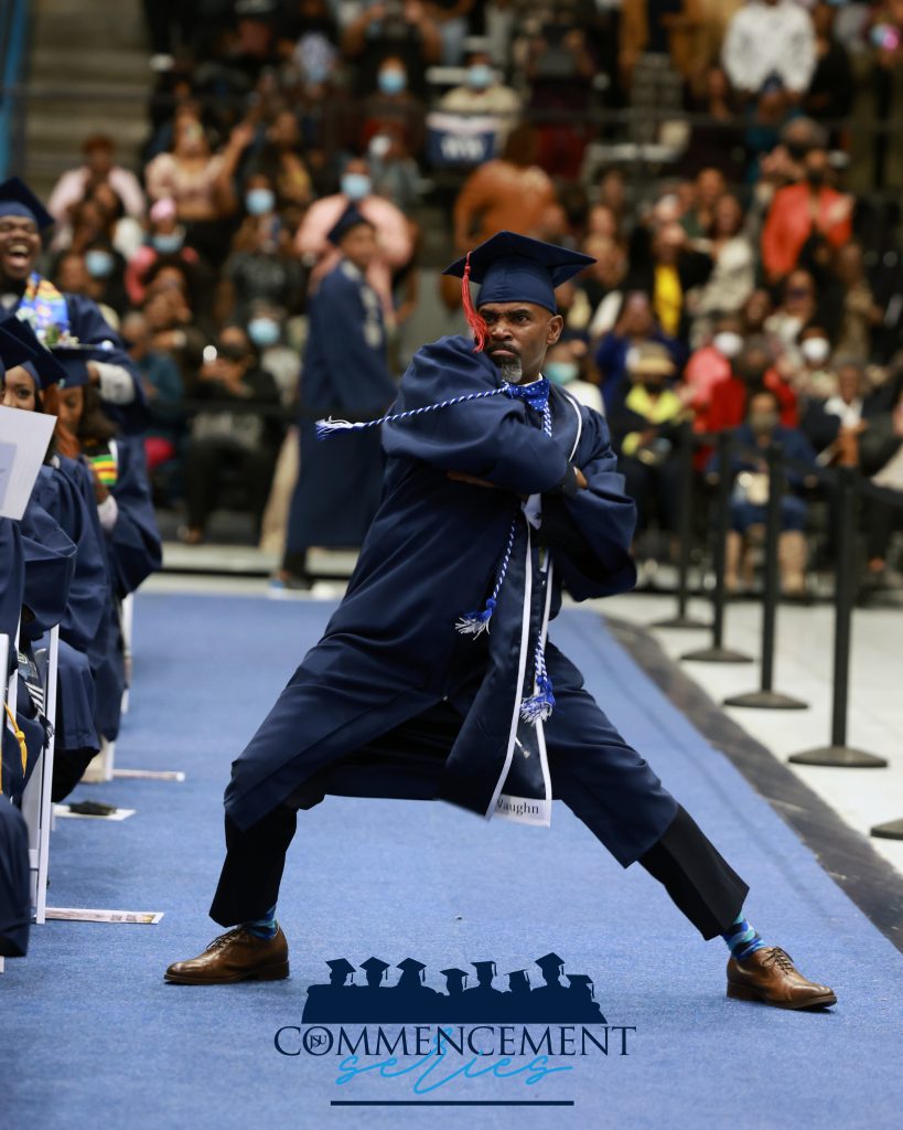 Vaughn celebrates as the orchestra plays 'Get Ready' at fall 2022 commencement. (Charles A. Smith/JSU University Communications)