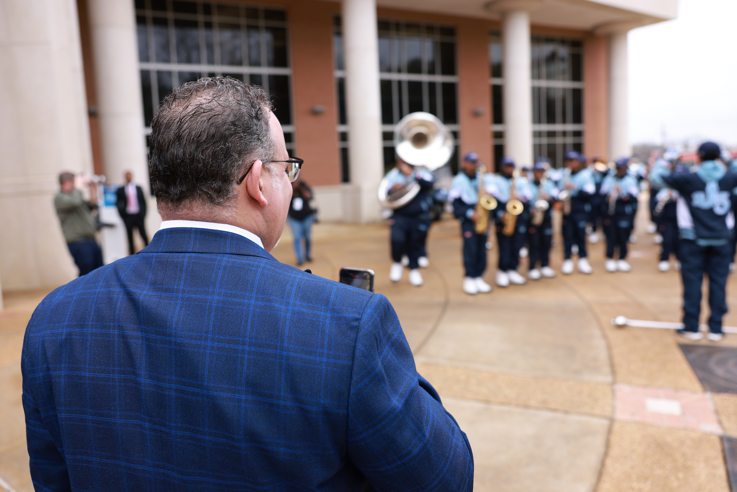U.S. Secretary of Education Miguel Cardona captures a surprise performance by the Sonic Boom of the South during his visit to Jackson State University on Wednesday. (Photo by William H. Kelly, III/JSU)