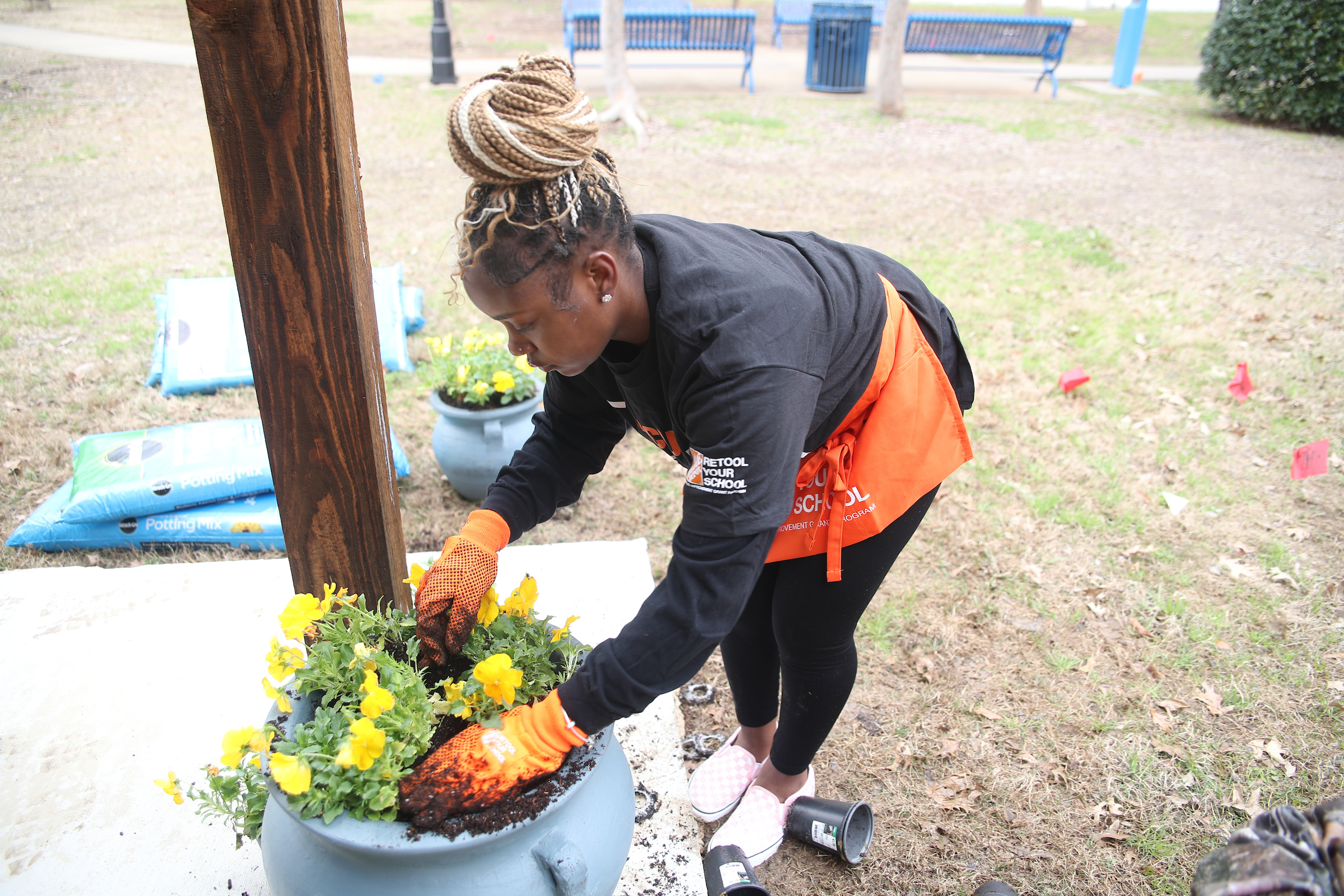 JSU student helps to beautify the outdoor space that was built using the Retool Your School grant funds JSU won last year. (Photo by Caleb Turner/JSU)