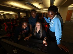 Dr. Almesha Campbell, Ph.D., associate vice president for research and economic development, with JSU Innovation Fellows inside the JSU Center for Innovation.
