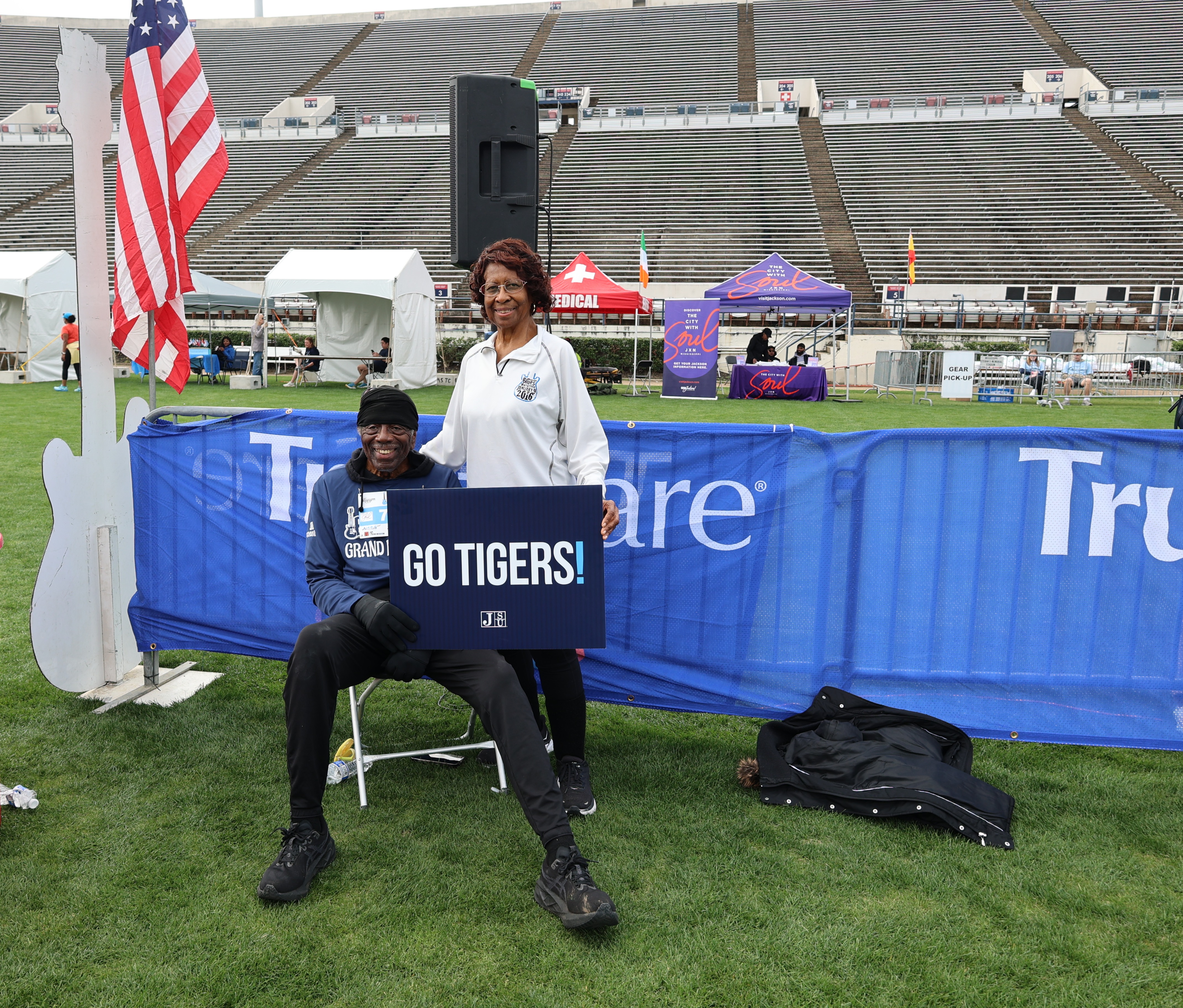 Dr. Hilliard Lackey and his wife pose near the finish line at the 19th Annual Mississippi Blues Marathon