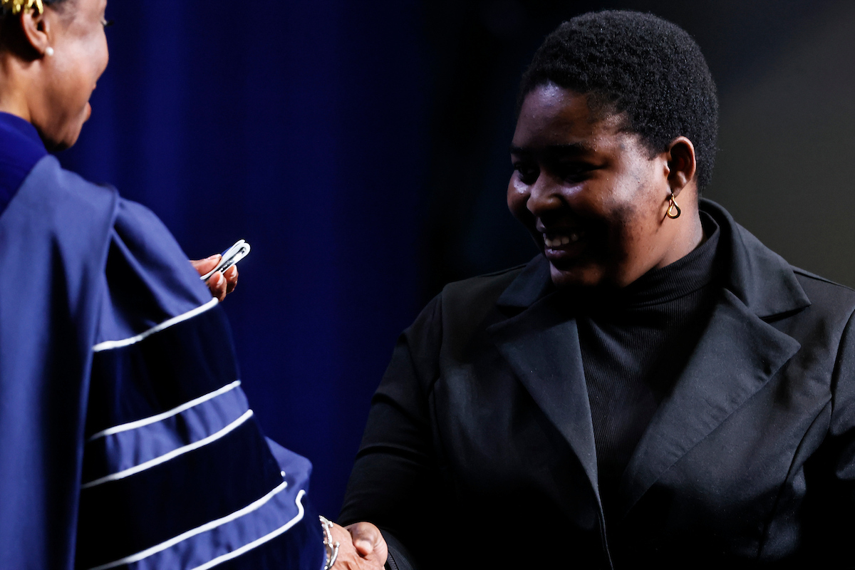 female student shakes hands with jsu leaders