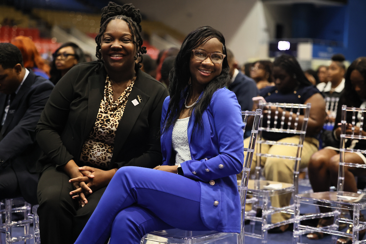 two students smile