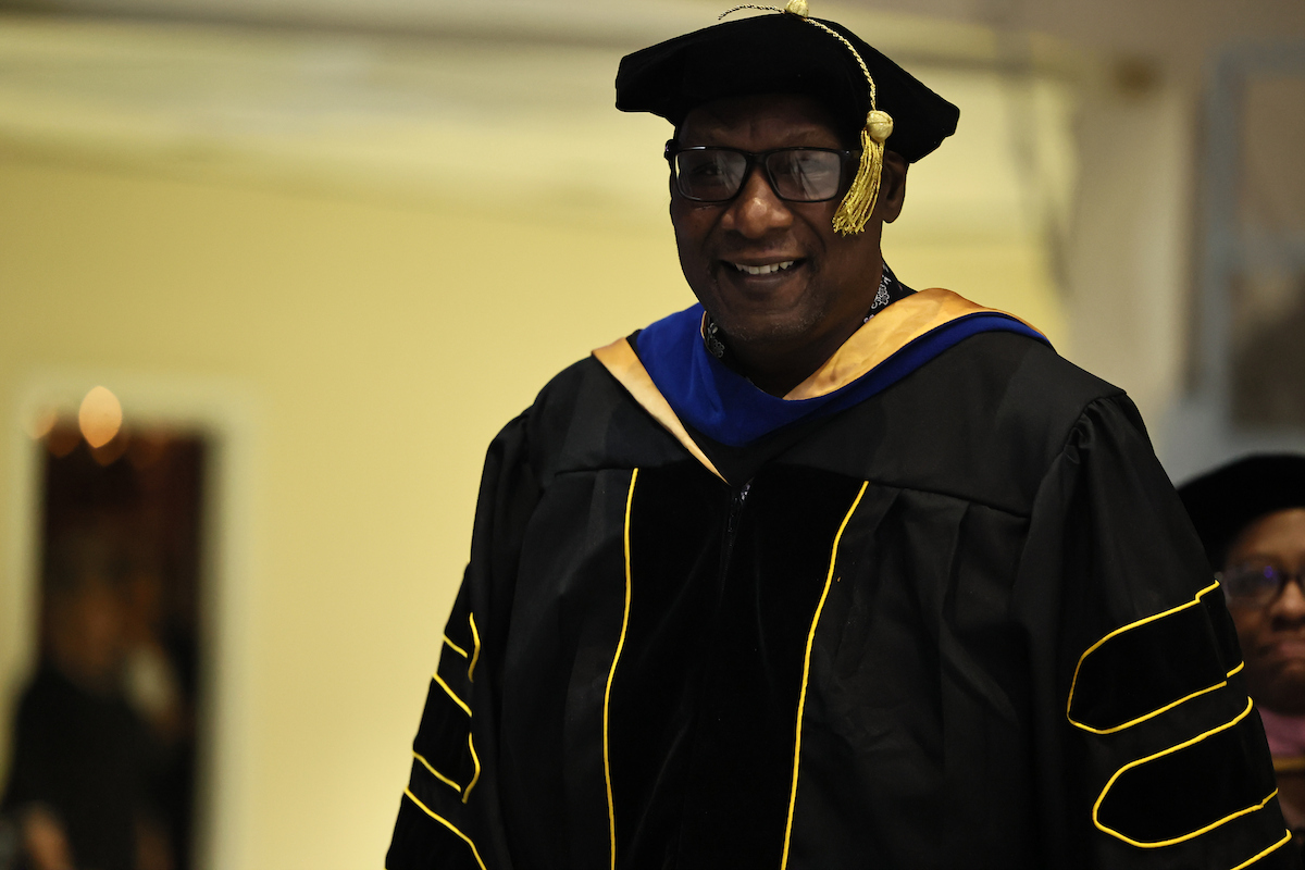 faculty member smiling