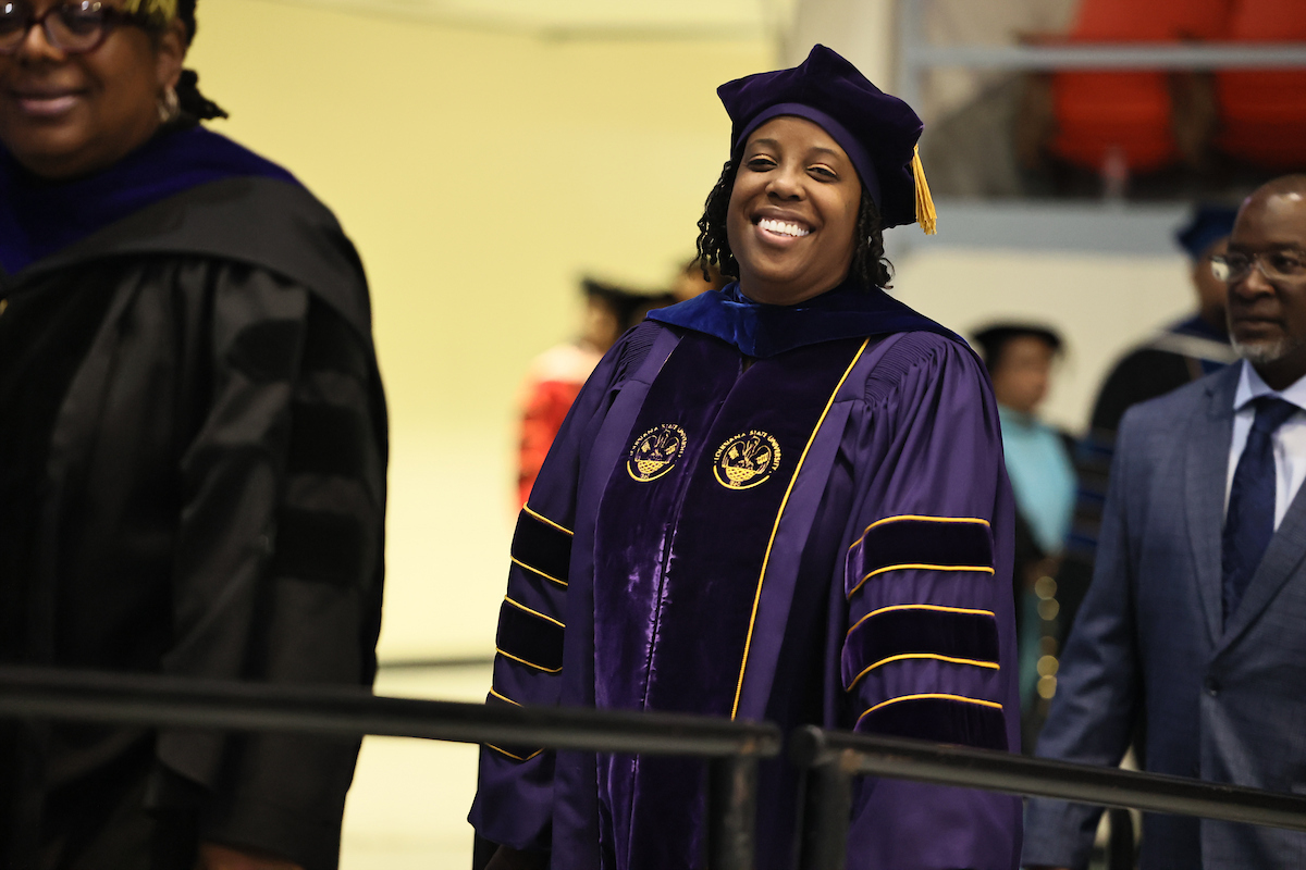 faculty member smiling