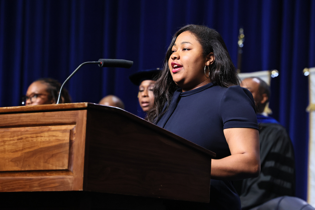 student speaks at podium
