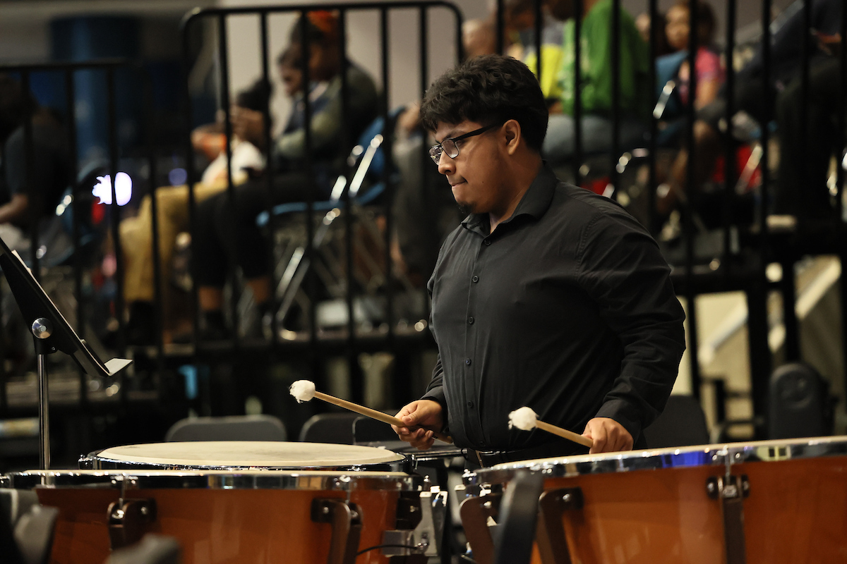 male student plays drums