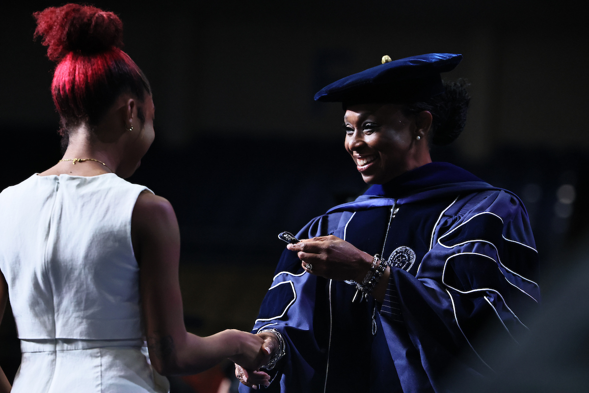 Dr. Gregory awards student with medal