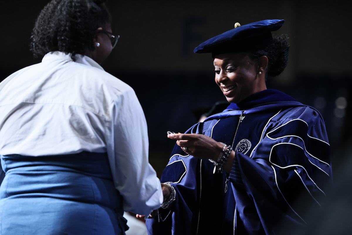 Dr. Gregory awards student with medal