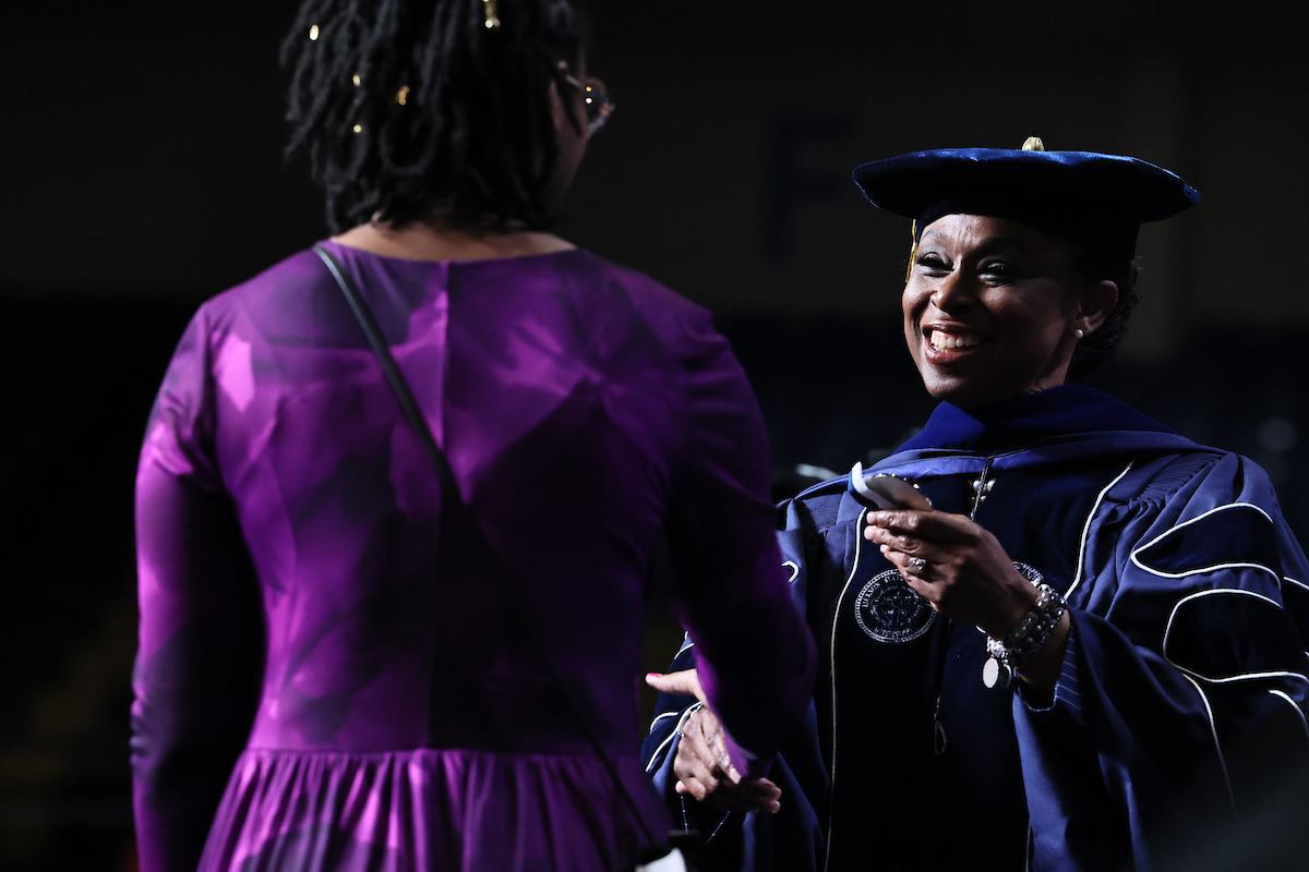 Dr. Gregory awards student with medal
