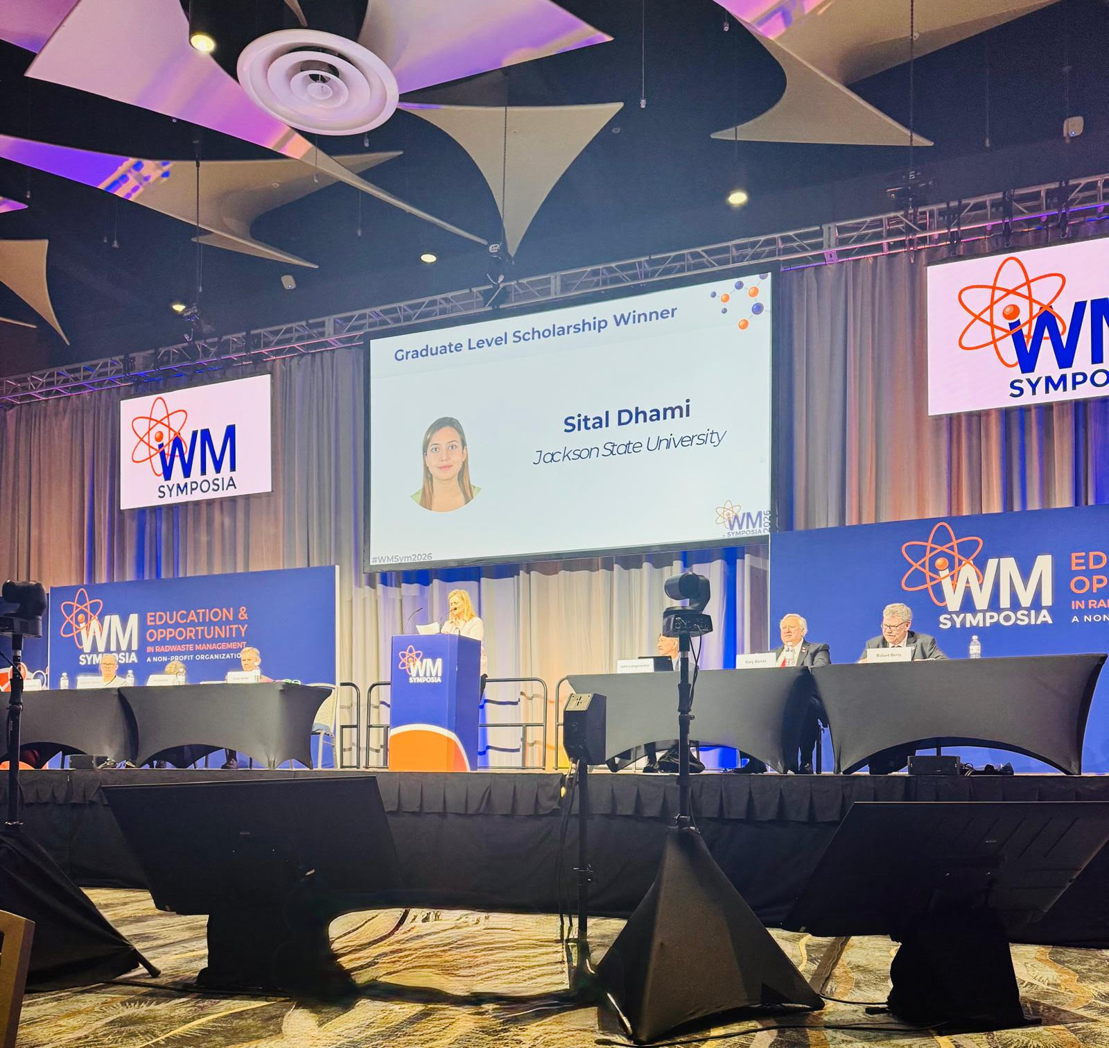 JSU chemistry doctoral student, Sital Dhami, is announced on screen as a Graduate Scholarship Winner of the Roy G. Post Scholarship at the WM2026 Conference in Phoenix, Arizona.